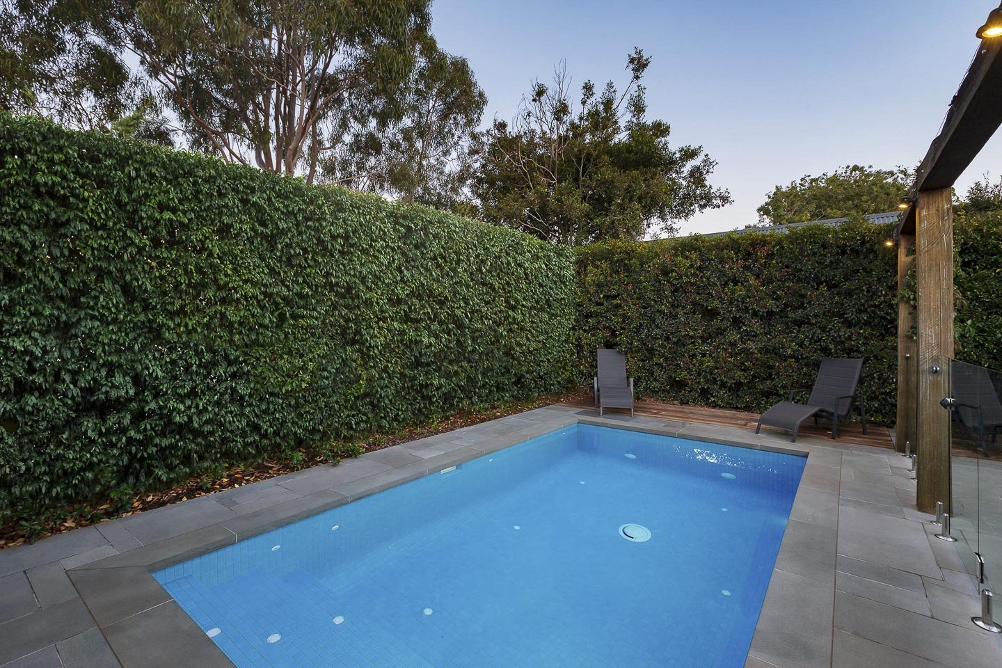 Blue concrete swimming pool.